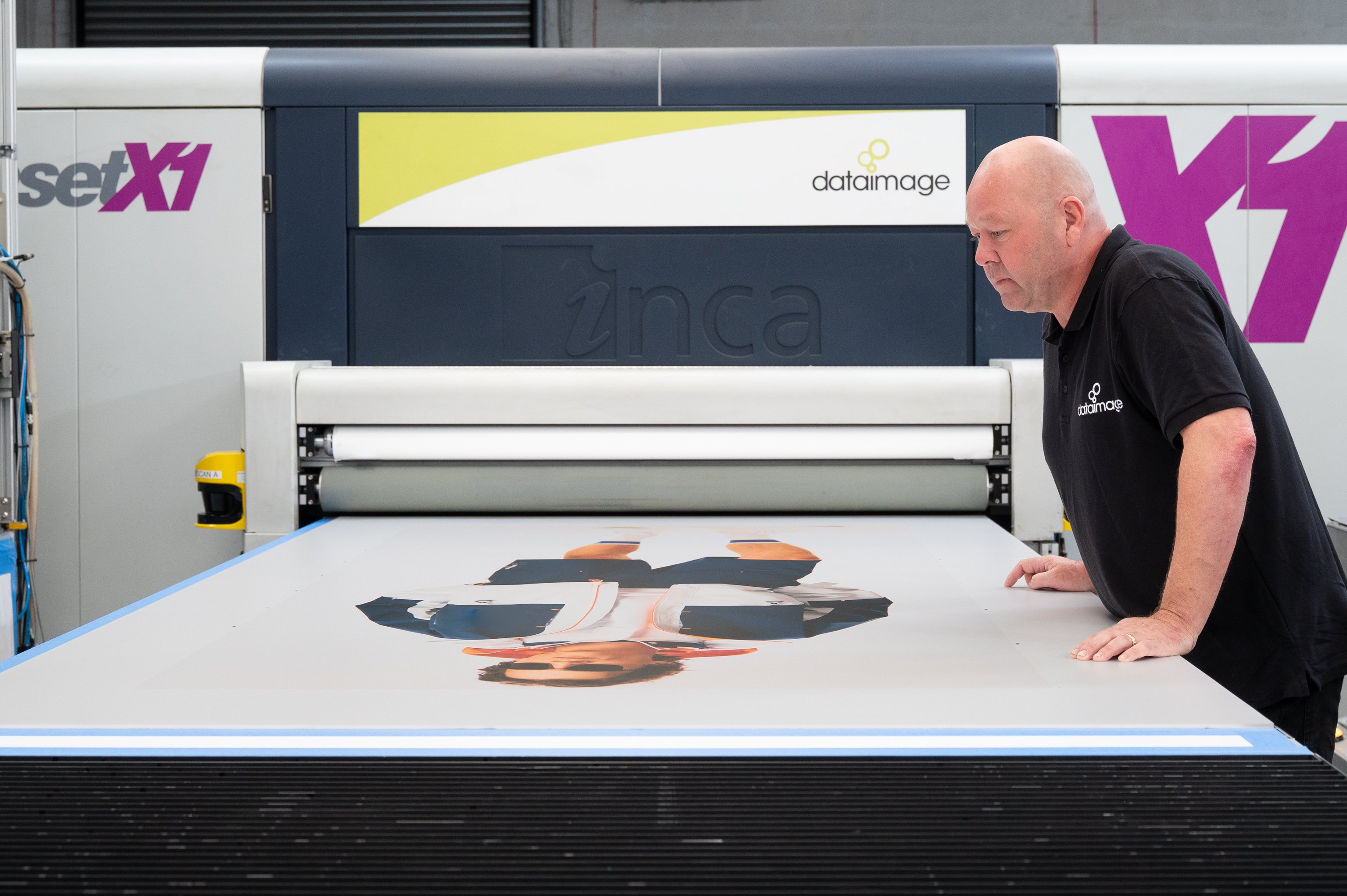 A POS Display Manufacturer oversees large-format printing equipment to ensure high-quality retail display production.
