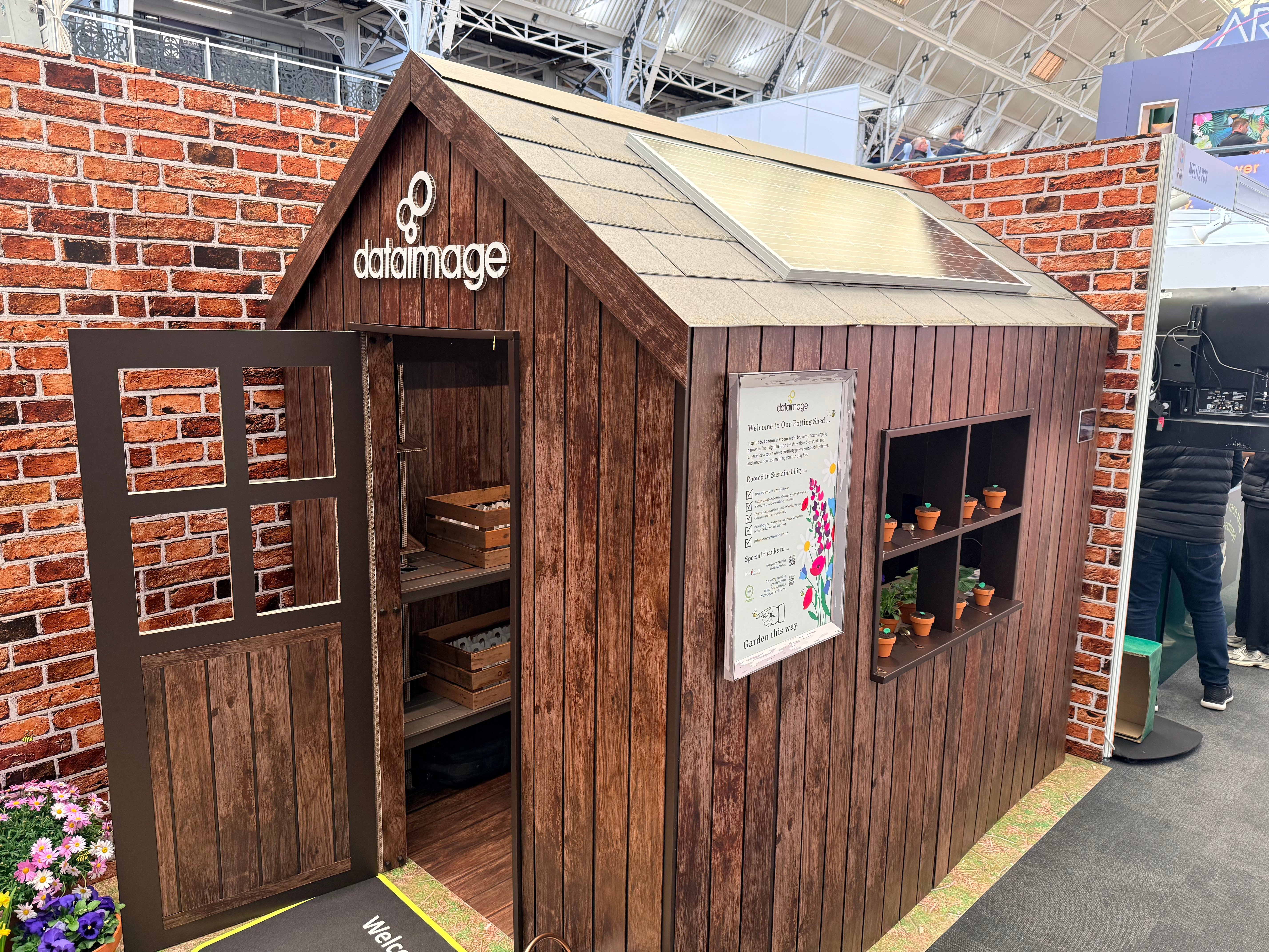 A 100% recyclable potting shed exhibition stand with solar roof and wall effect stand walls