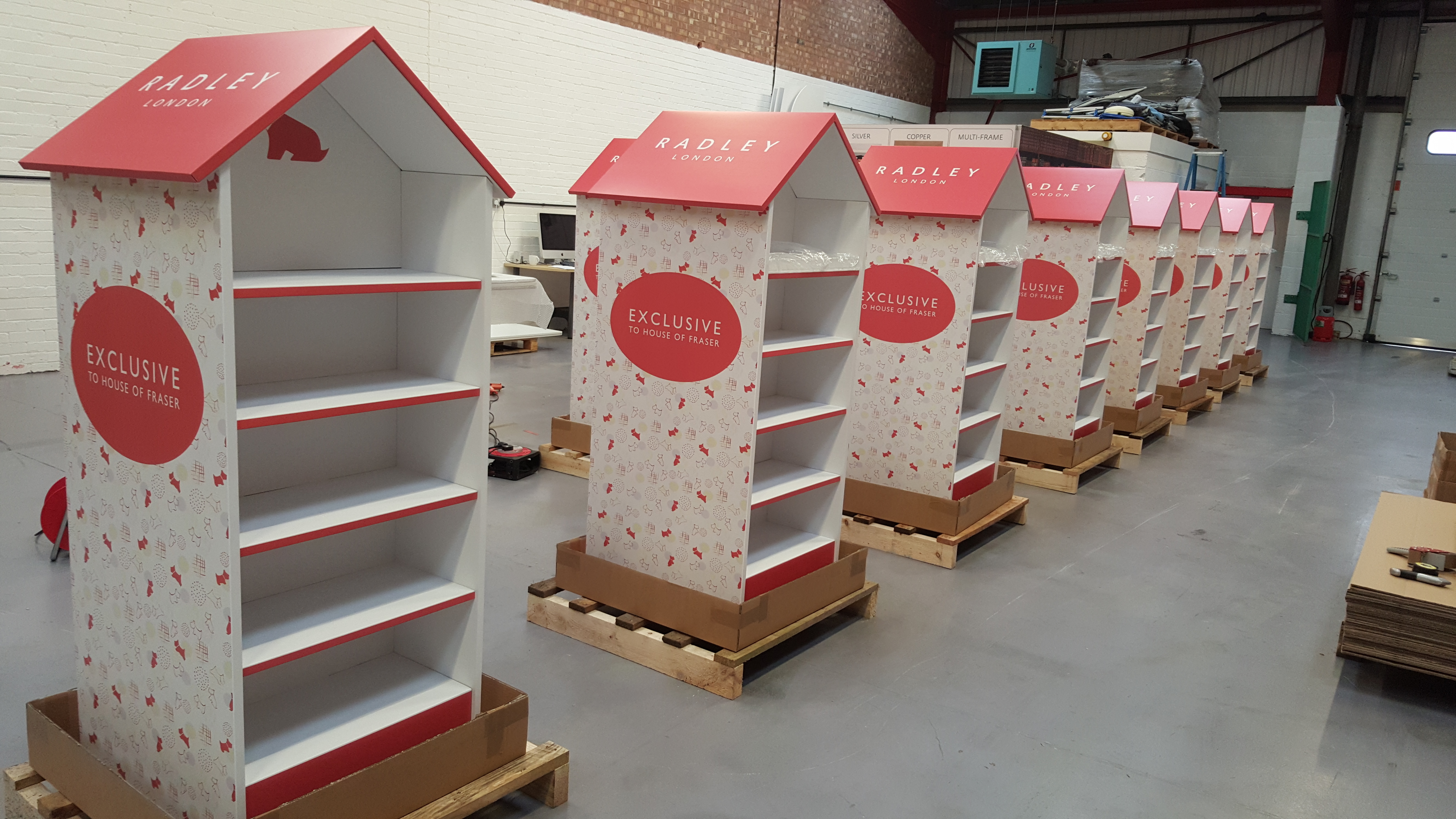 Retail display featuring branded POS campaign materials, product packaging and promotional signage prepared for in-store marketing activation.