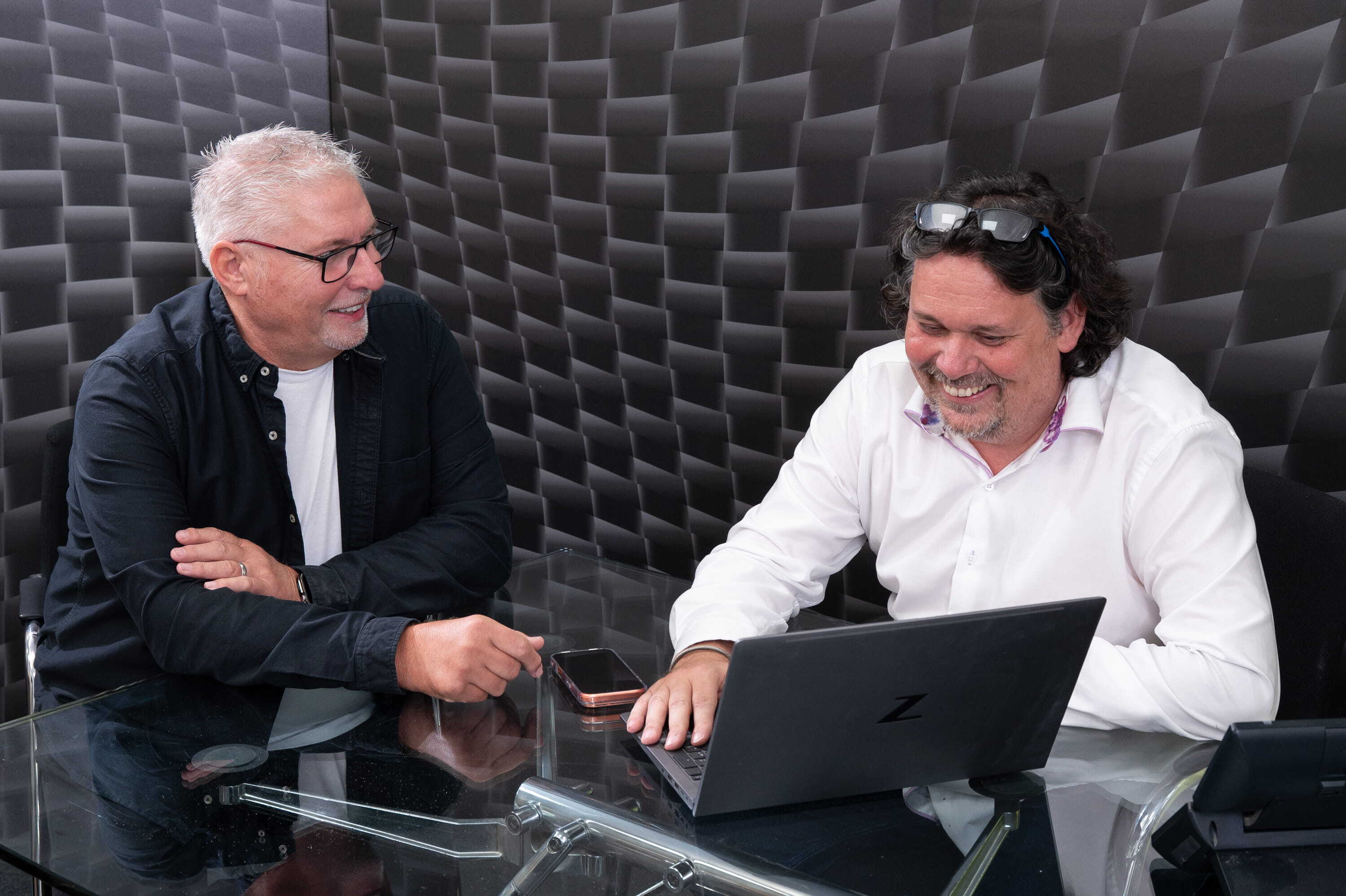 A men discussing challenges with a POS display supplier.