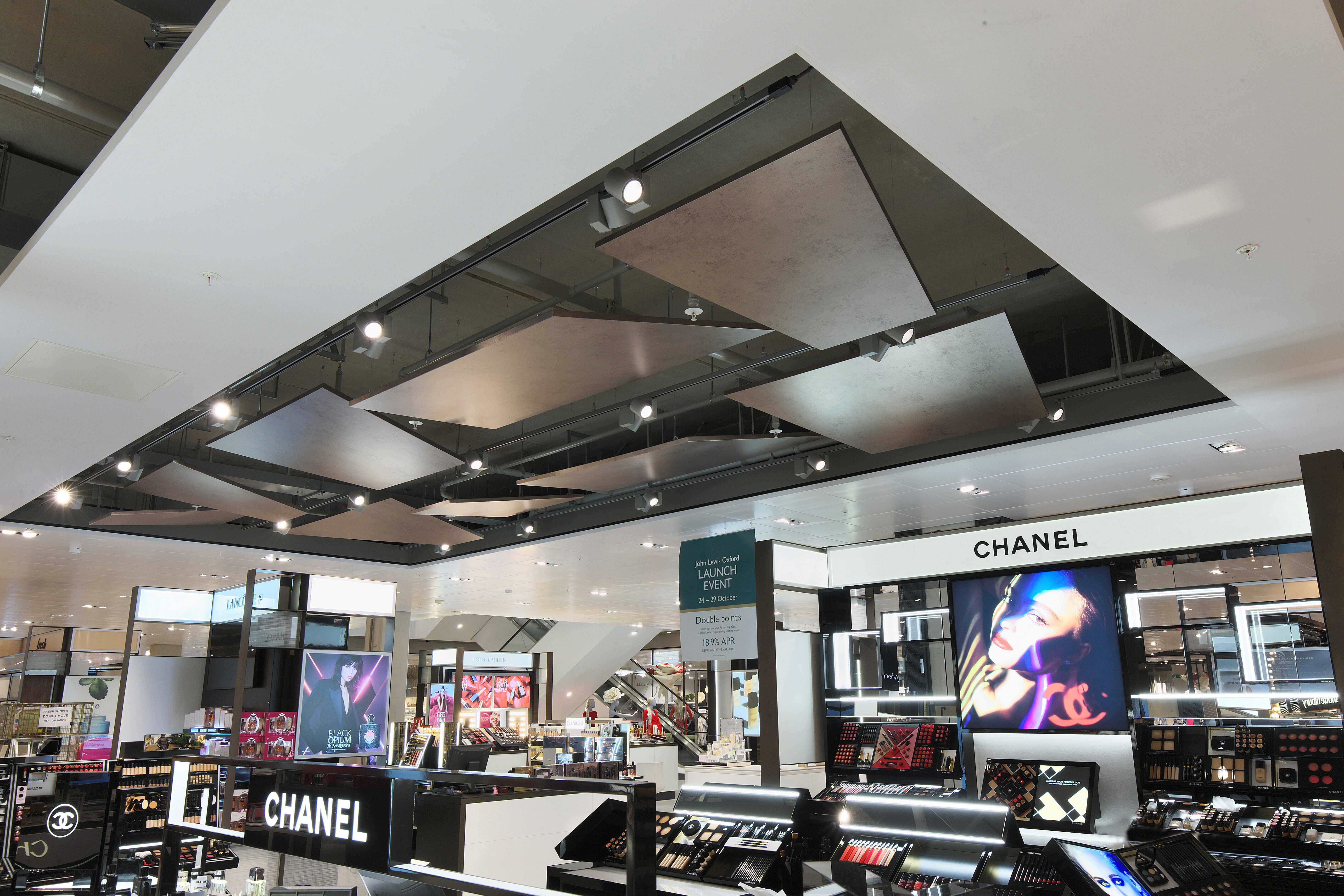 A retail cosmetic display in a department store where technology is being used.